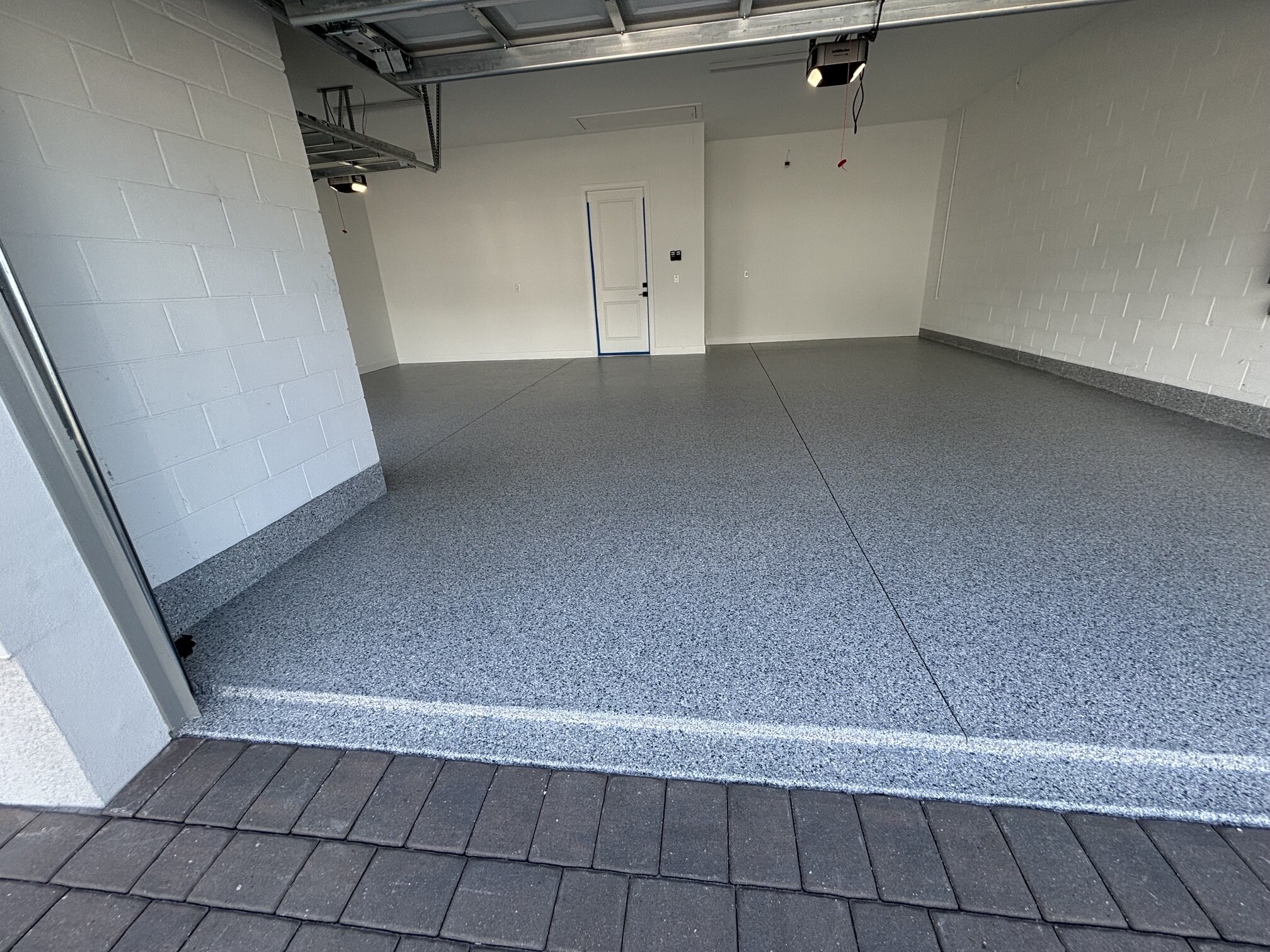 Finished gray flake garage floor for the Beachwalk project in Englewood