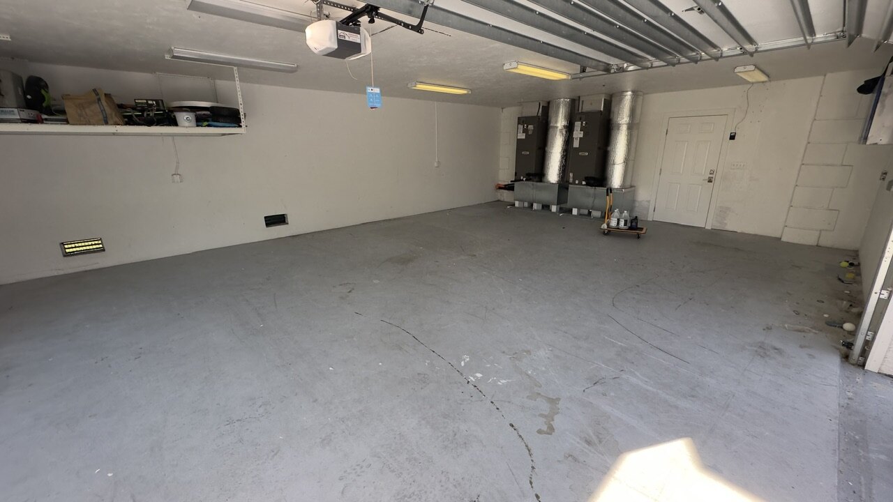 Existing concrete floor in a Marco Island garage before the finished-floor photos