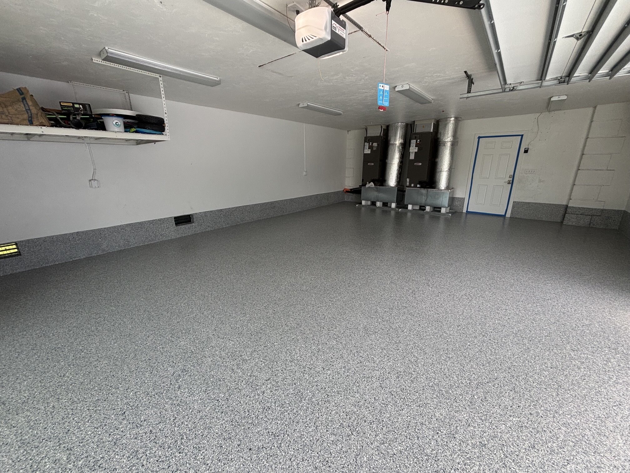 Wide view of the finished gray flake floor in a Marco Island garage