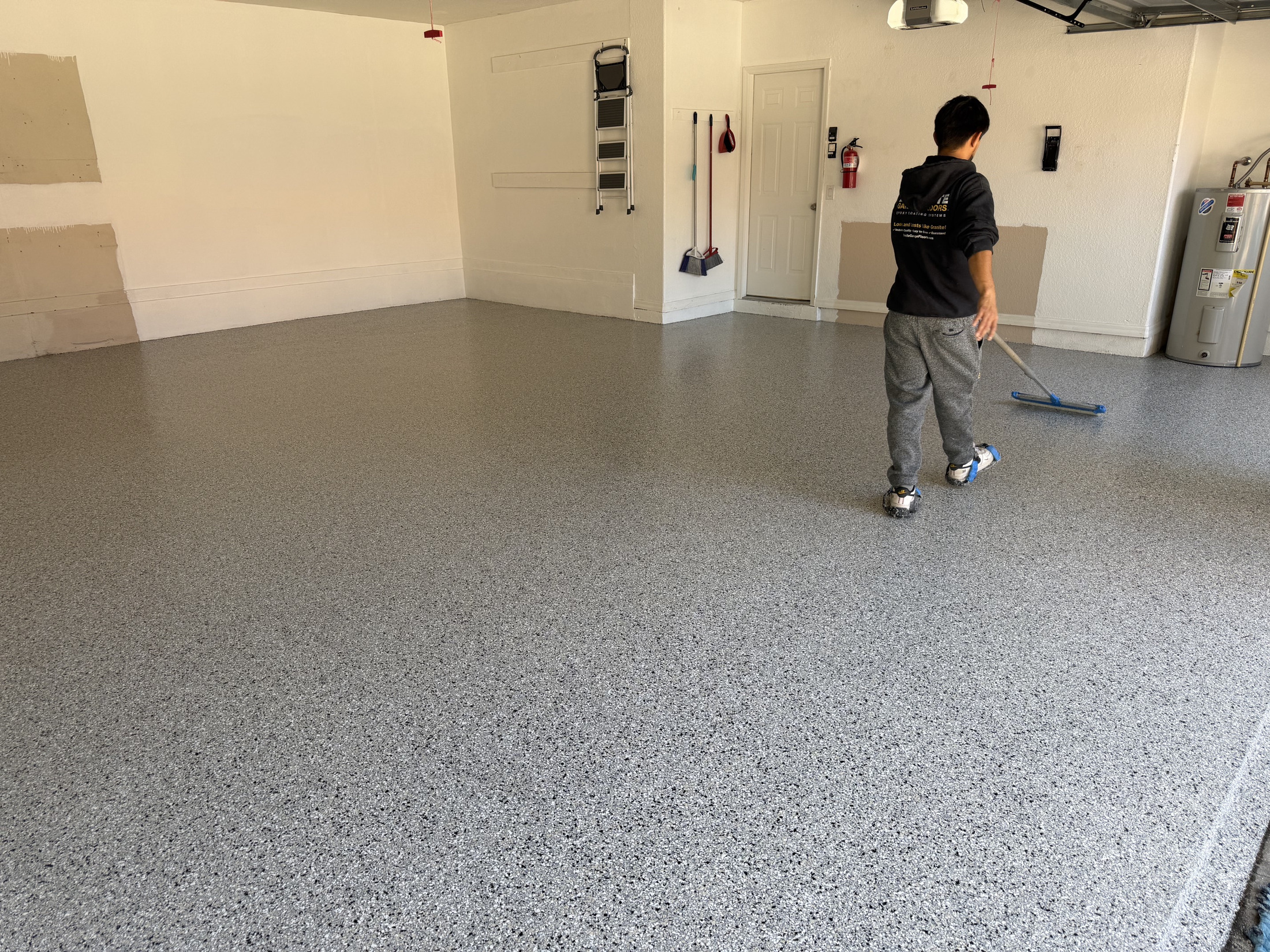 High-resolution finished residential garage with decorative floor coating