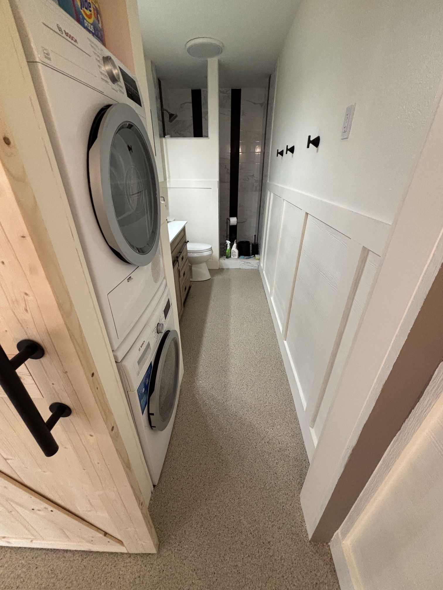 Finished decorative concrete coating in a bright interior utility and laundry space