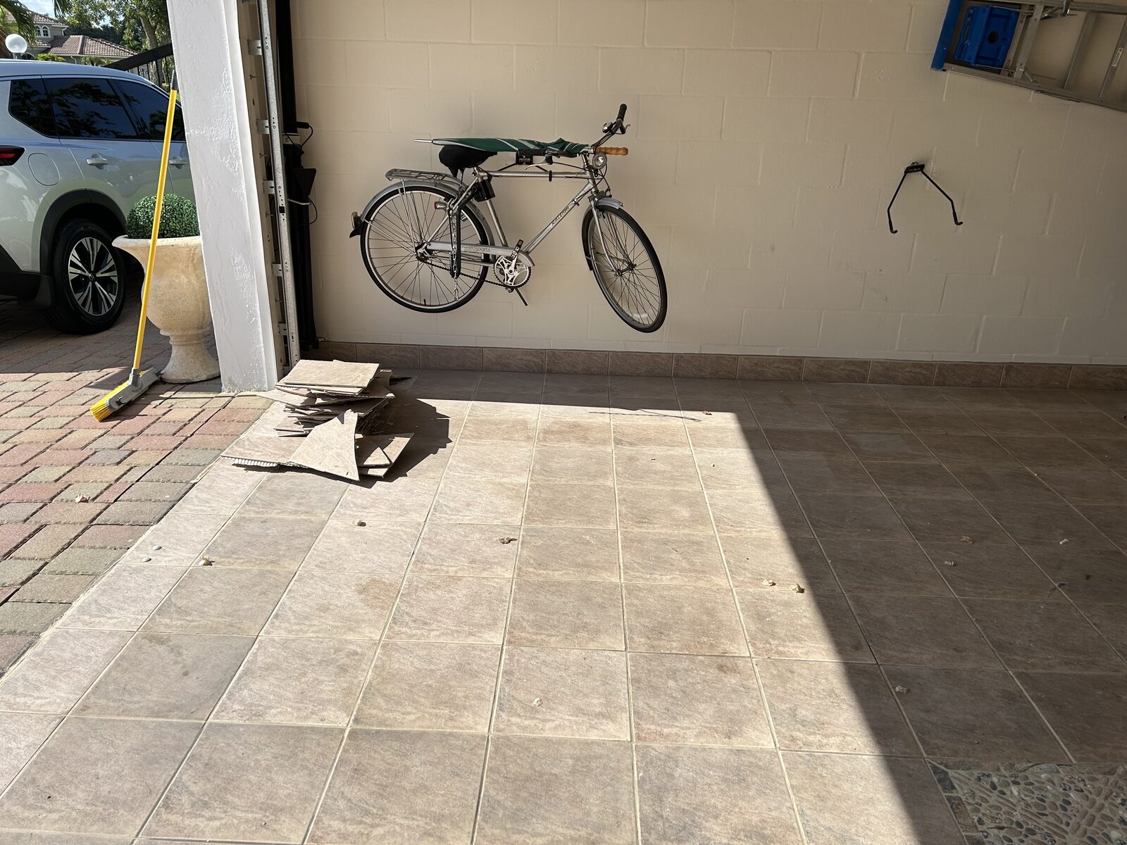 Garage floor before removal and coating work begins