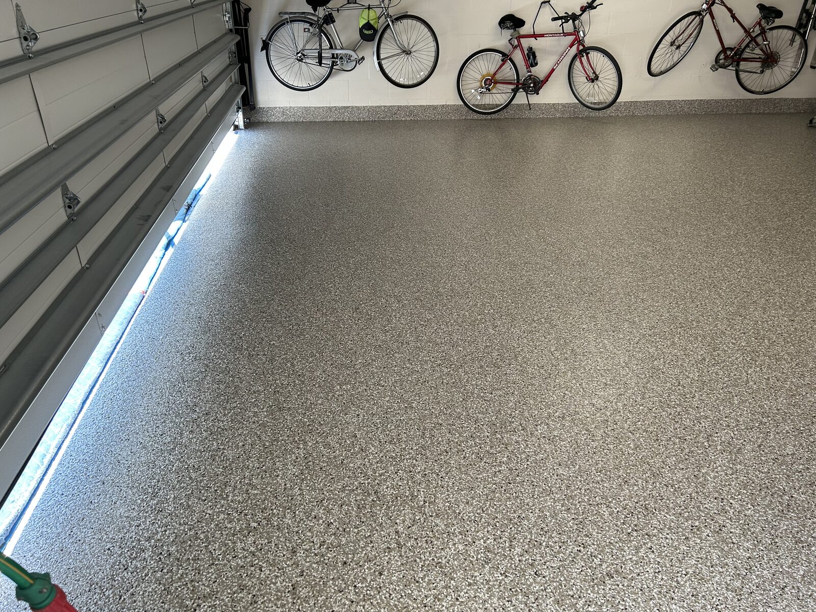 Completed garage with a fresh decorative flake floor coating
