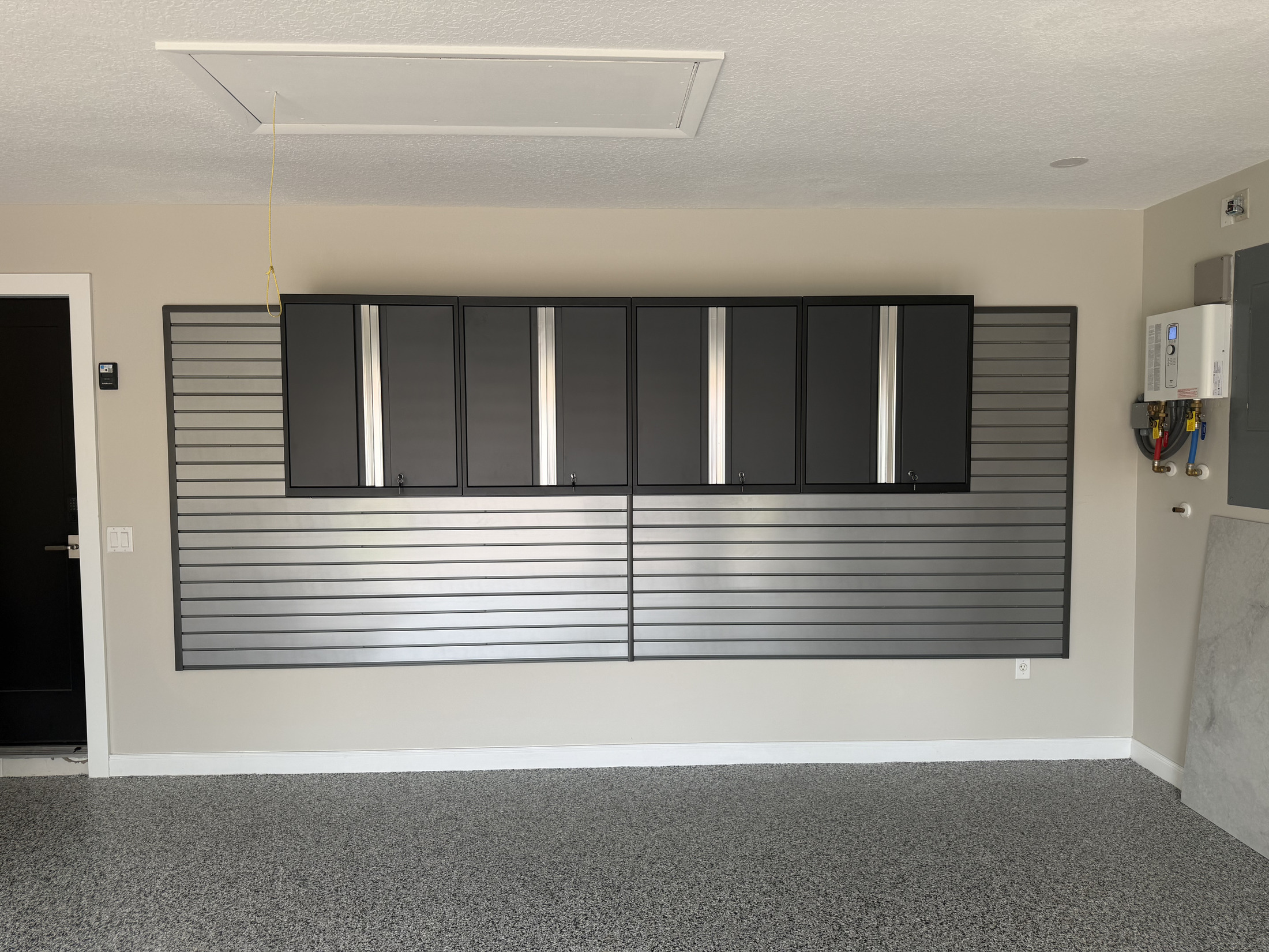 Garage organization system using slatwall to keep gear off the floor
