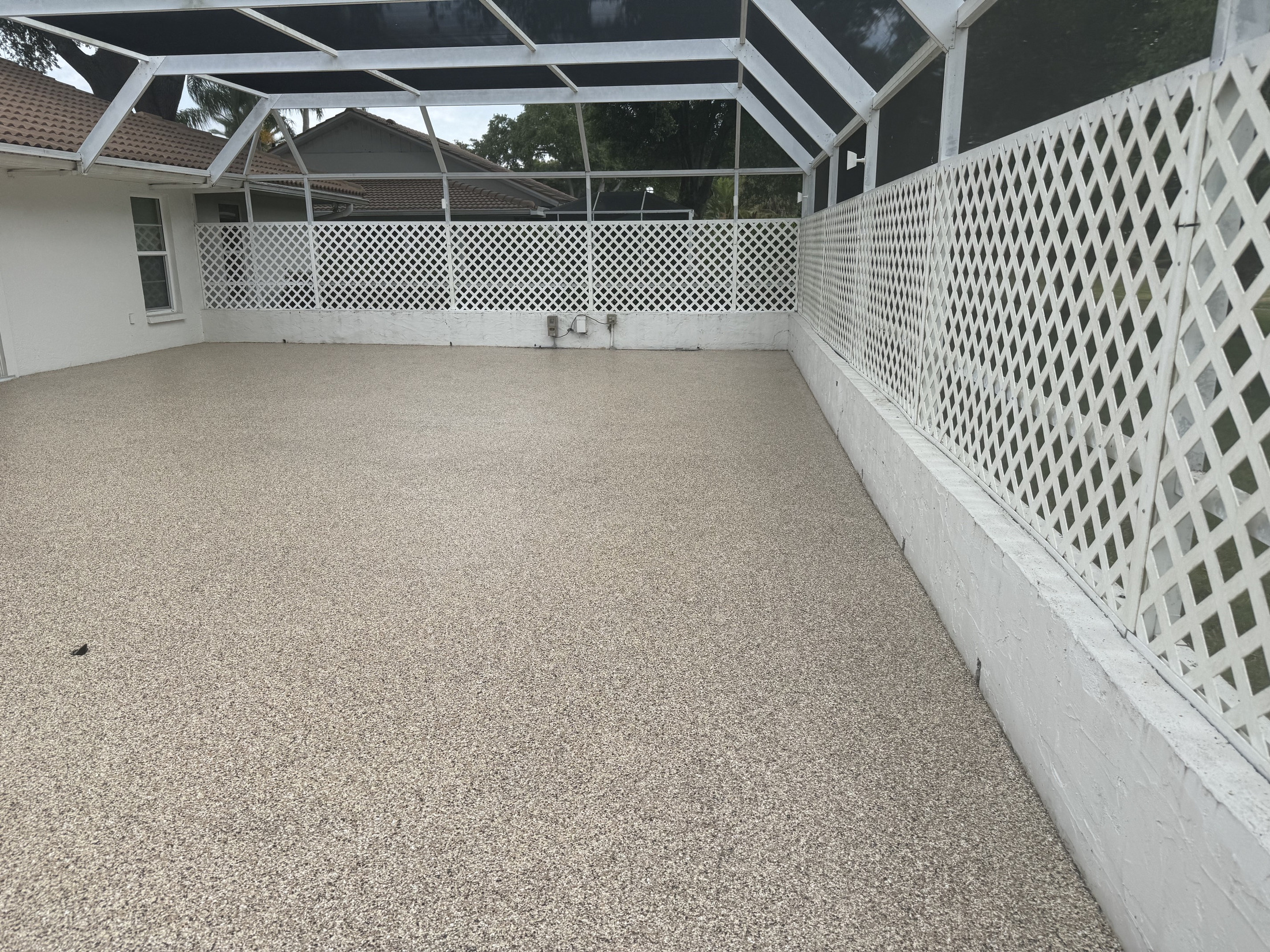 Finished patio and outdoor living area with decorative concrete coating