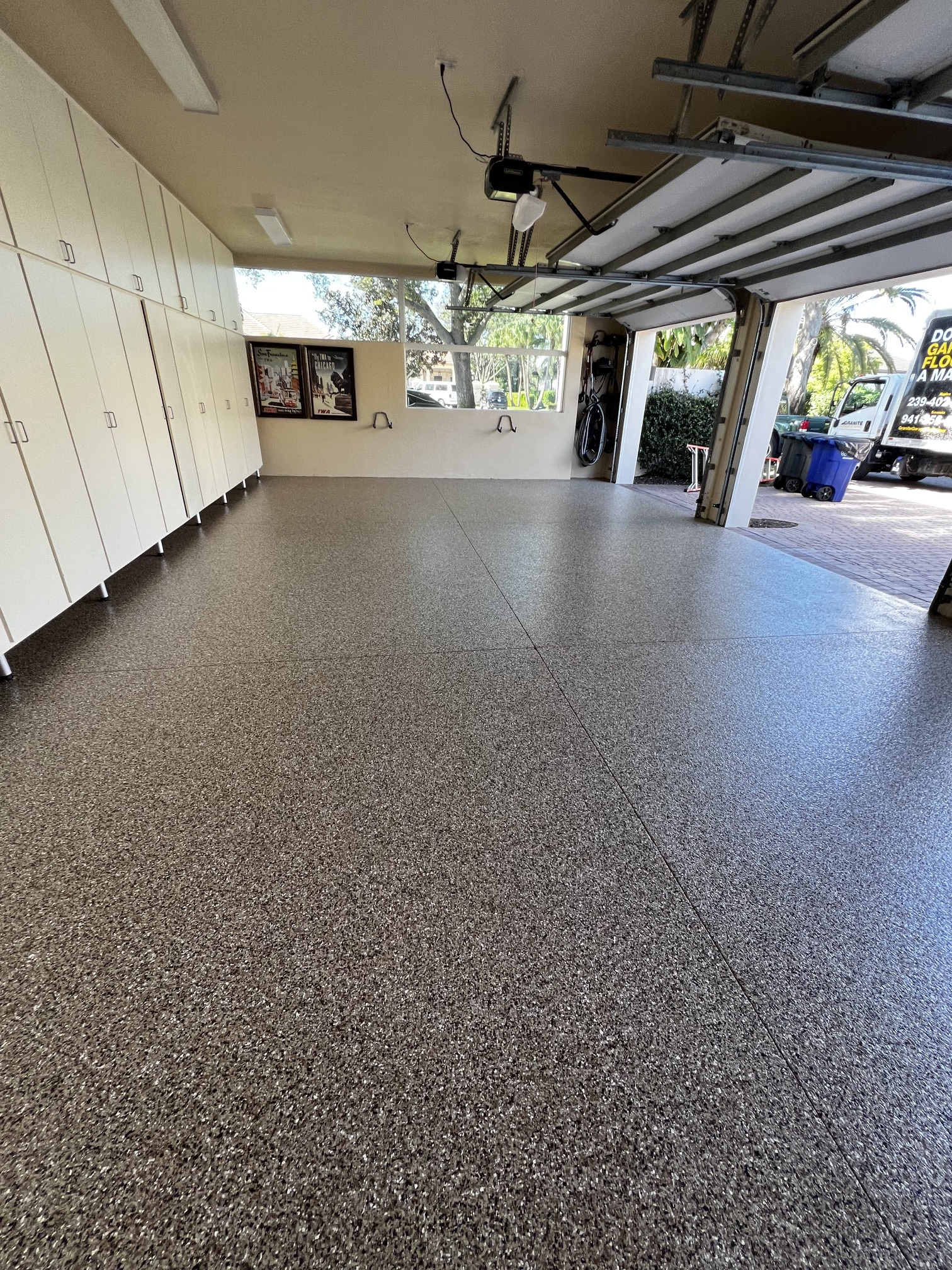 Finished residential garage with a clean decorative floor coating