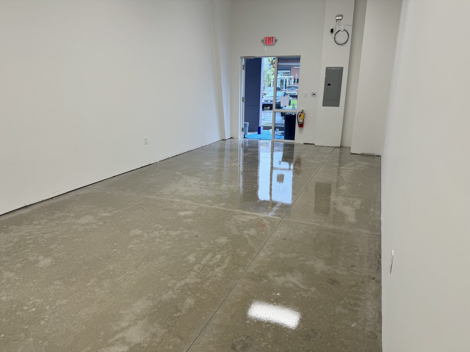 Wide view of an interior concrete floor with a clear finish