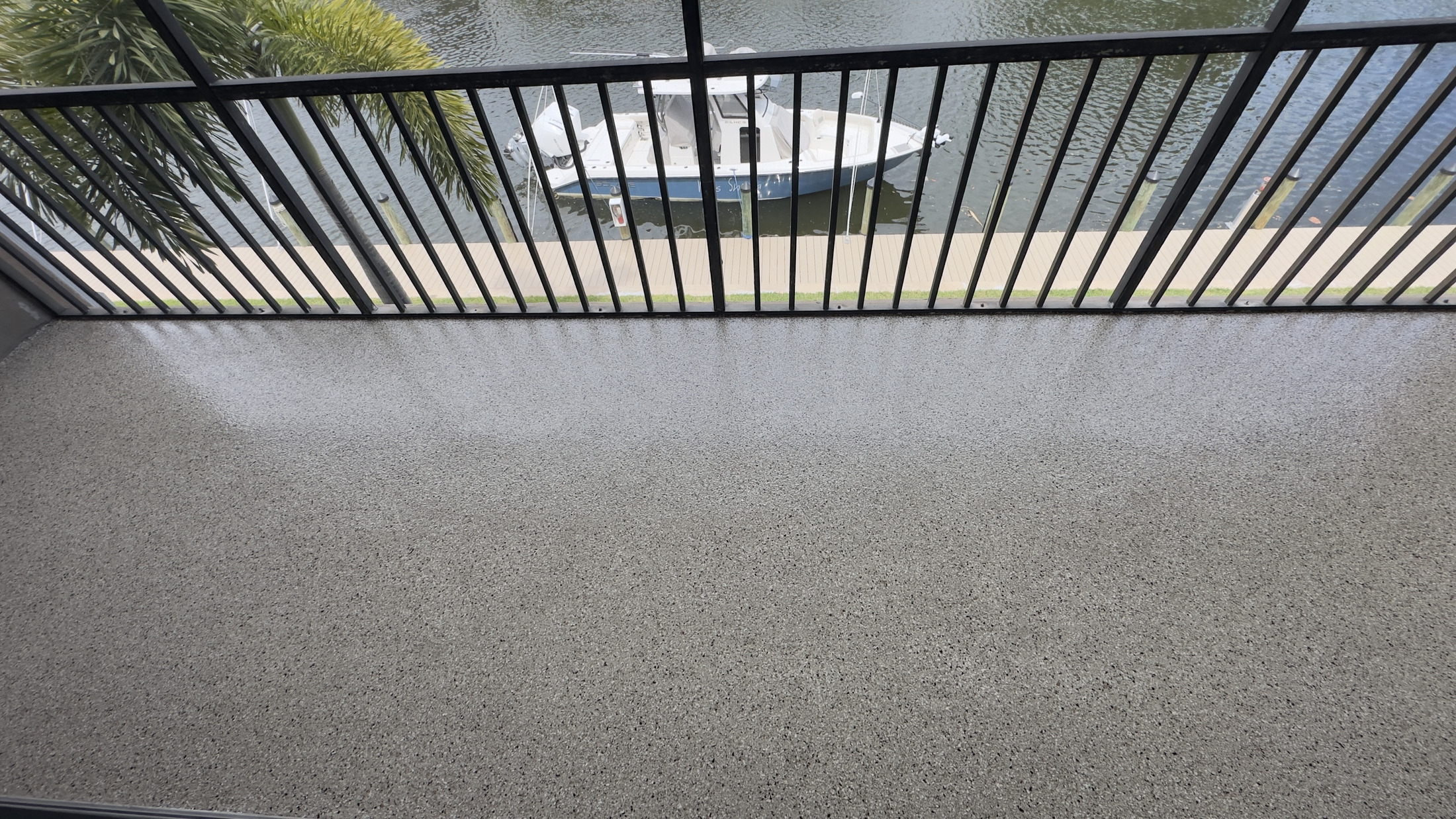 Finished covered lanai with decorative concrete floor coating