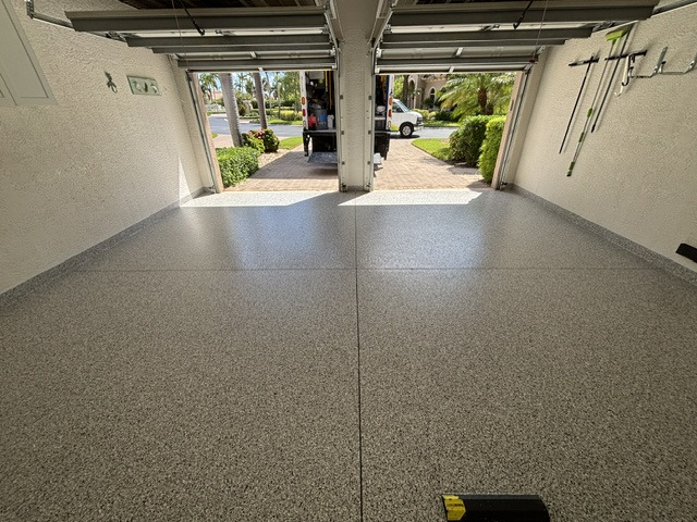Finished light-colored decorative flake floor in a residential garage