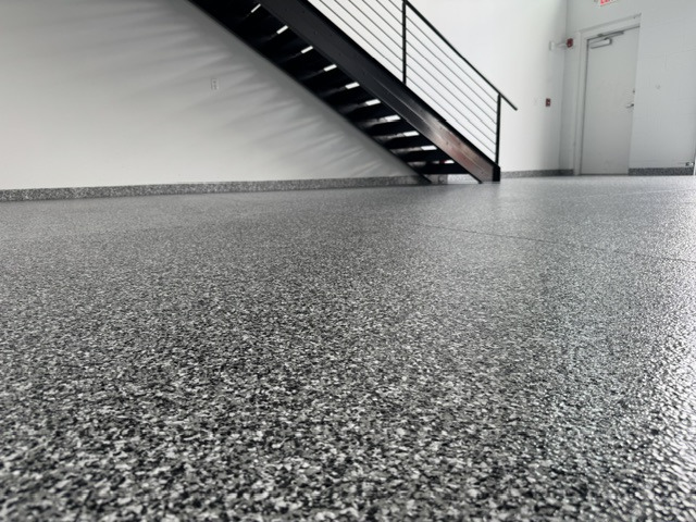 Completed residential garage with a decorative coating and clean edges