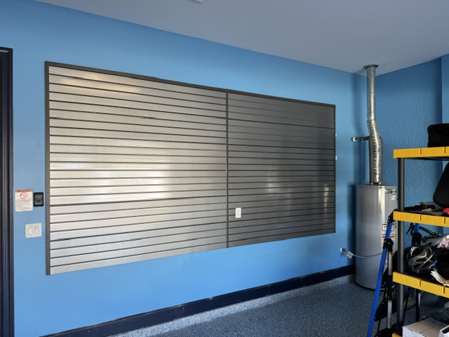 Finished garage wall organization using slatwall panels