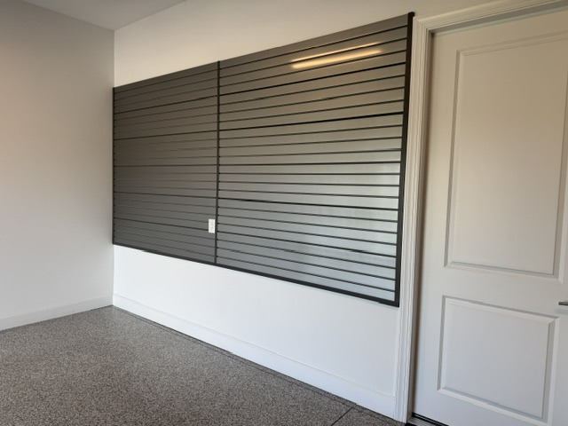 Garage slatwall storage system with organized hooks and accessories