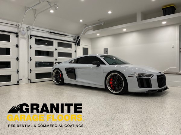 White sports car in a bright garage with a decorative floor coating
