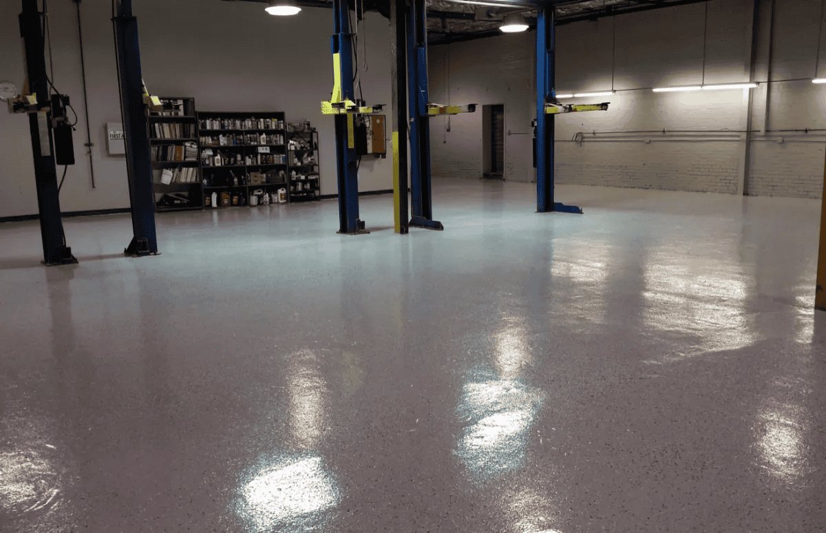 Finished commercial workshop floor with vehicle lifts