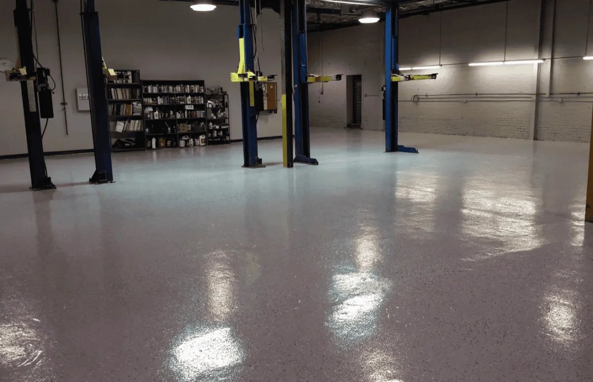 Finished commercial workshop floor with vehicle lifts