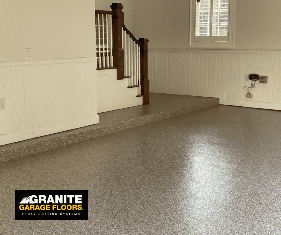 Coated entryway floor beneath an interior staircase