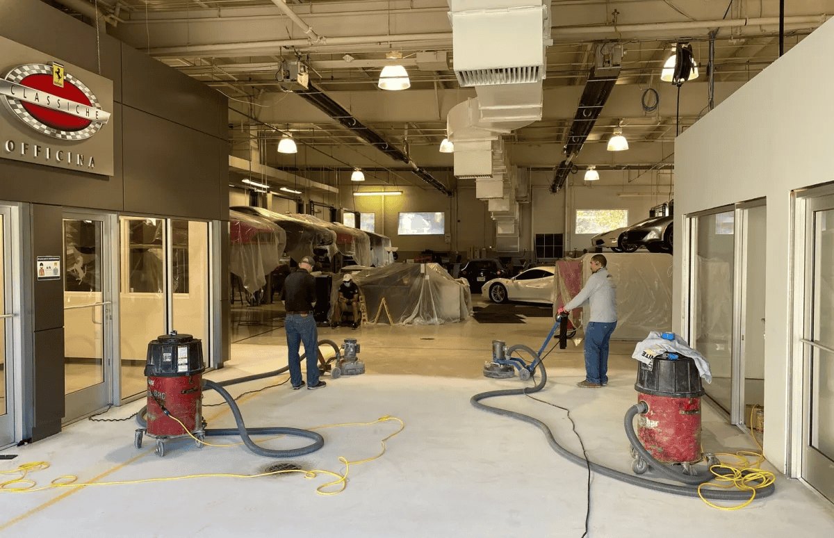 Crew and floor-preparation equipment inside a commercial space