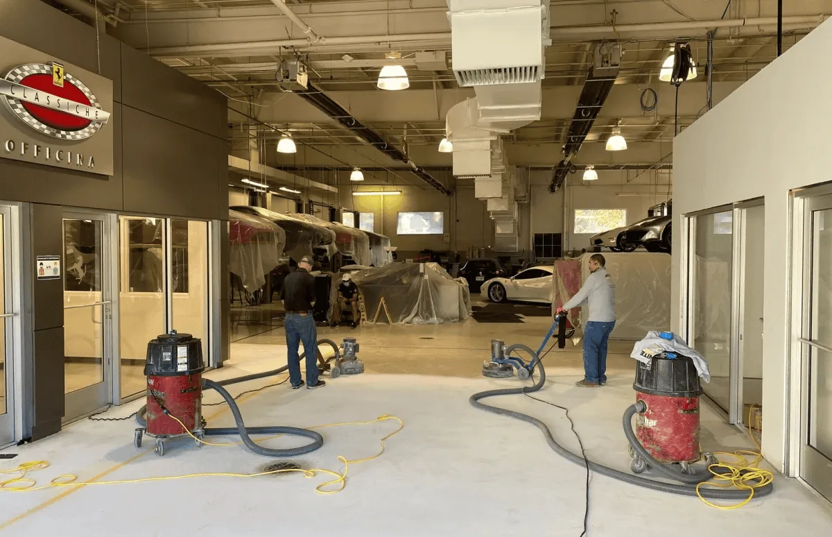 Crew and floor-preparation equipment inside a commercial space